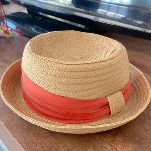 Rattan hat with coral band.